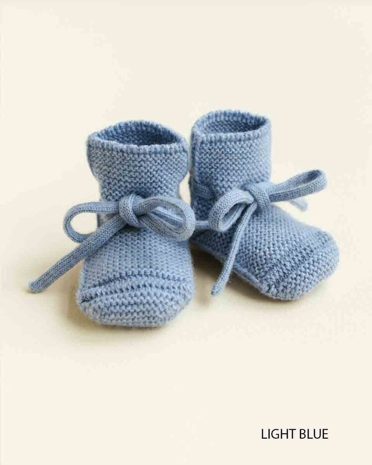 Hvid babyslofjes van merinowol lichtblauw