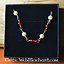 Collier romaine avec des pierres rouges - Celtic Webmerchant