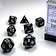 Chessex Polyhedral 7 tärningar, ogenomskinlig, svart/vit - Celtic Webmerchant