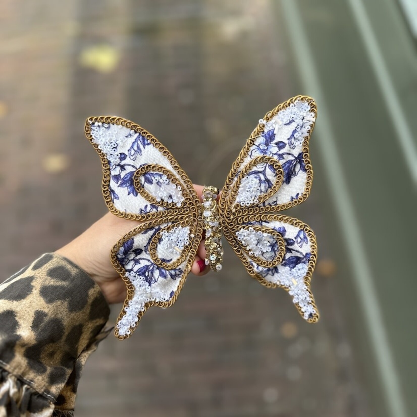 Vlinders op klip, goud