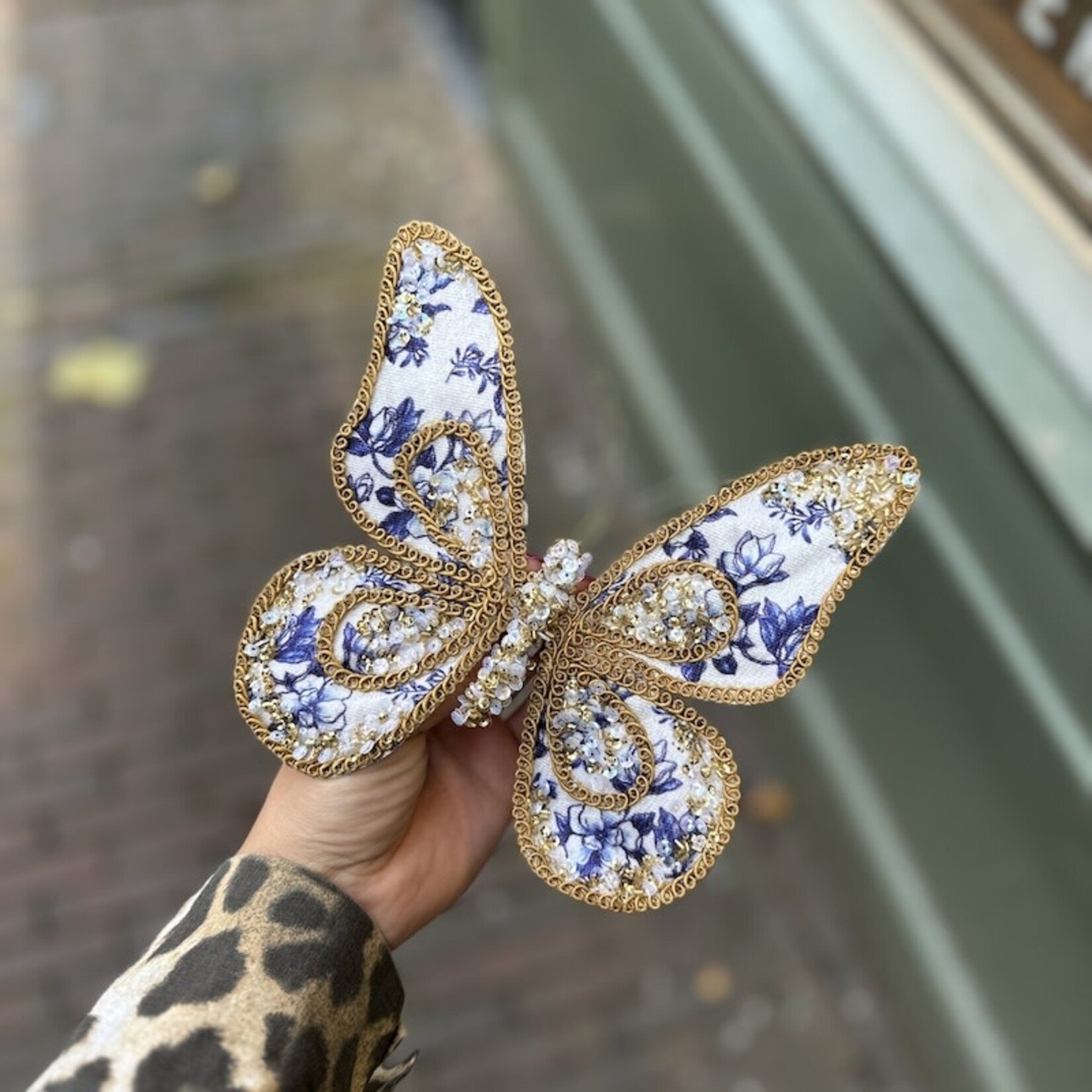 Vlinders op klip, goud