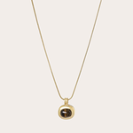 Lange ketting met gouden hanger met gemstone