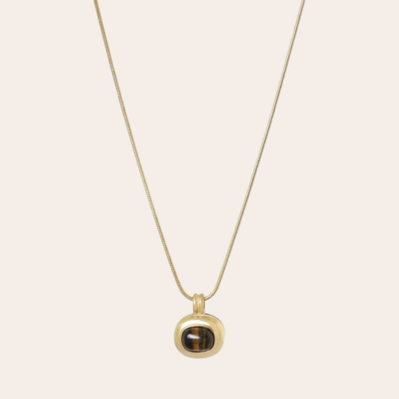 Lange ketting met gouden hanger met gemstone