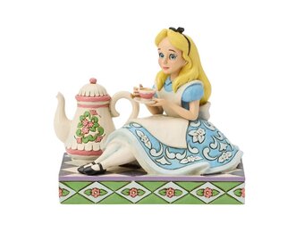 Figurine: Alice with Teapot - A Cup of Curiosity