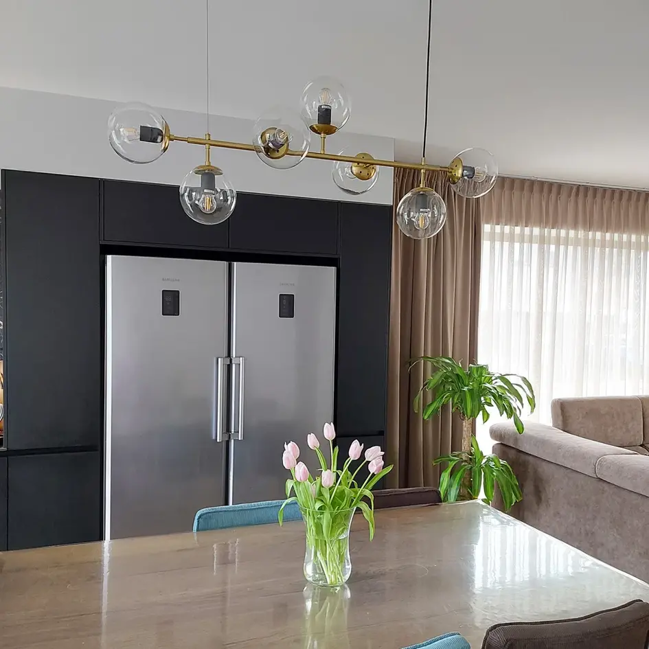 Design hanglamp Hepta gouden frame en transparant glas