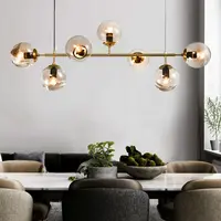 Design hanglamp Hepta gouden frame en transparant glas