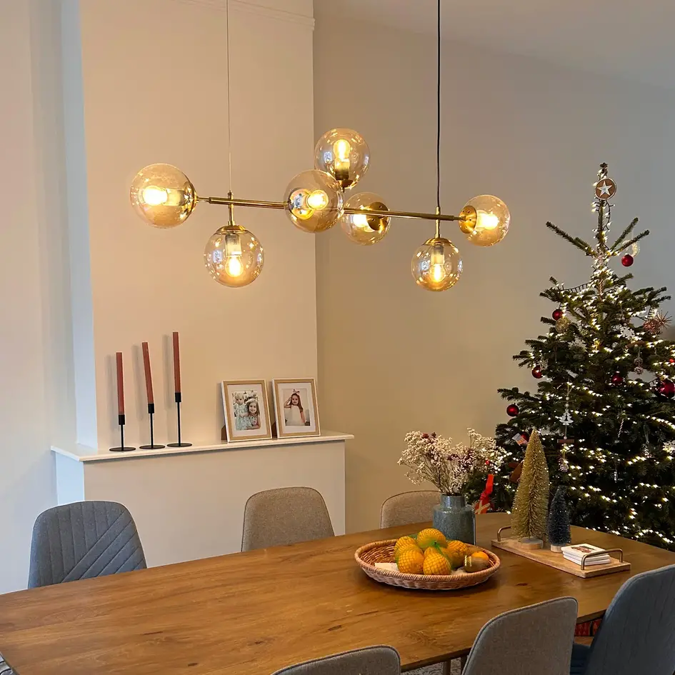 Design hanglamp Hepta gouden frame en amber glas