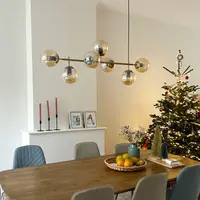 Design hanglamp Hepta gouden frame en amber glas