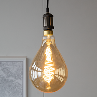 Filament-LED-lampa dimbar 8,5 watt, amber croissantspiral 160 mm