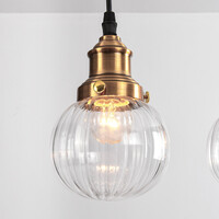 Art deco-pendellampa Bologna med fyra lampor - transparent glas