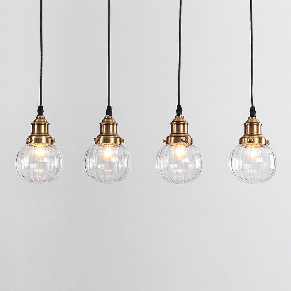 Art deco-pendellampa Bologna med fyra lampor - transparent glas
