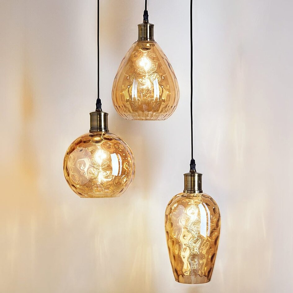 Designad pendellampa Verona med tre lampor - amberfärgat glas med rundad form