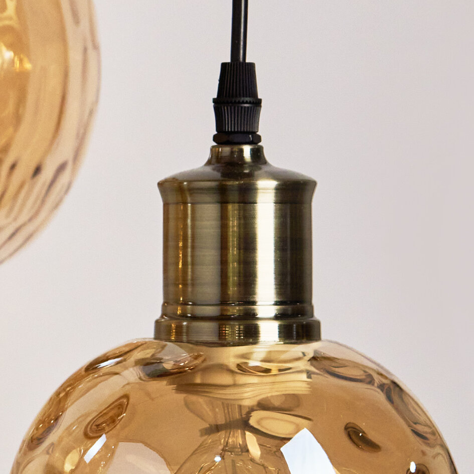 Designad pendellampa Verona med tre lampor - amberfärgat glas med rundad form