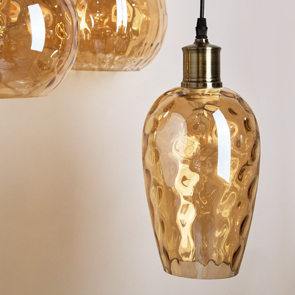 Designad pendellampa Verona med tre lampor - amberfärgat glas med rundad form