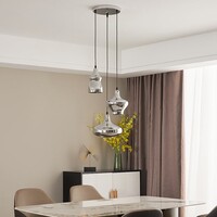 Designad pendellampa Bari med tre lampor i kromglas