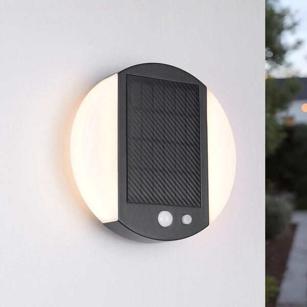 Modern solcellsdriven utomhusvägglampa med sensor svart - Blitz