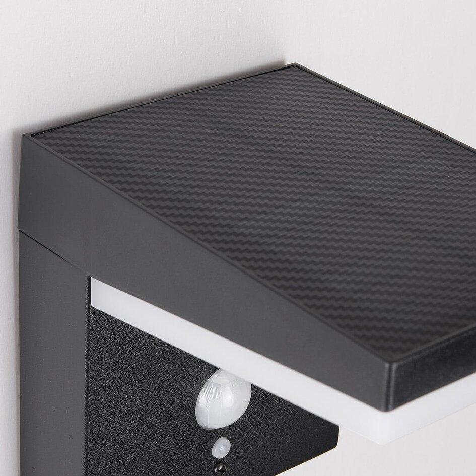 Modern solcellsvägglampa i svart med sensor - Halo