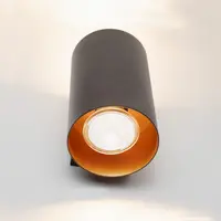 Modern vägglampa Meg i svart med guldfärgad insida
