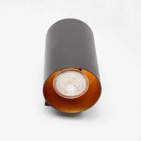 Modern vägglampa Meg i svart med guldfärgad insida