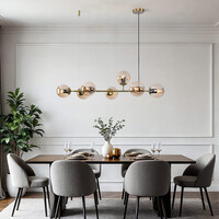 Designad pendellampa Sette med sju lampor - amberfärgat glas och guld
