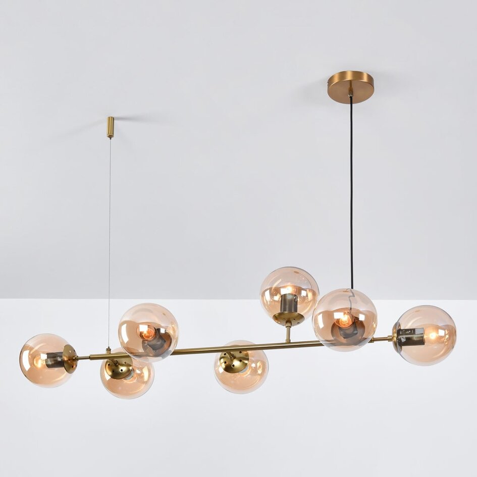 Designad pendellampa Sette med sju lampor - amberfärgat glas och guld