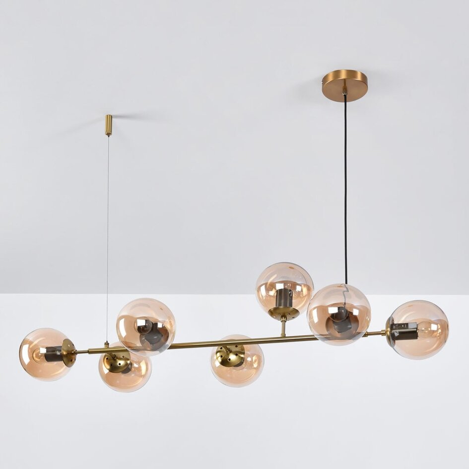 Designad pendellampa Sette med sju lampor - amberfärgat glas och guld