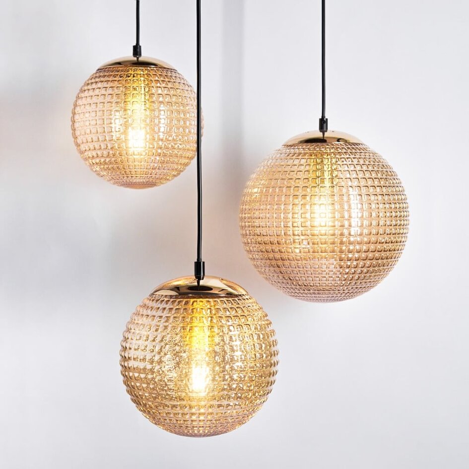 Designad pendellampa Sila med tre lampor - räfflat amberfärgat glas