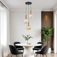 Designad pendellampa Sita med tre lampor - svart och guld med amberfärgat glas