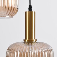 Designad pendellampa Sita med tre lampor - svart och guld med amberfärgat glas
