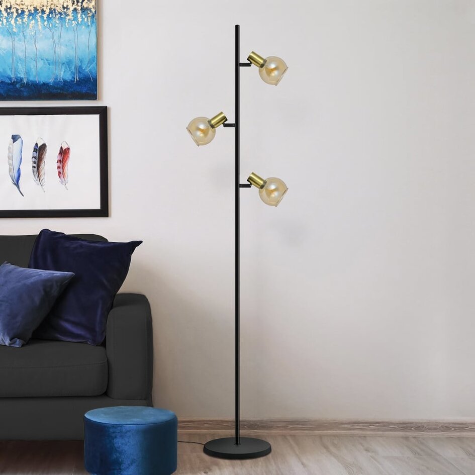 Modern golvlampa Fayette med tre lampor i sandguld med amberglas