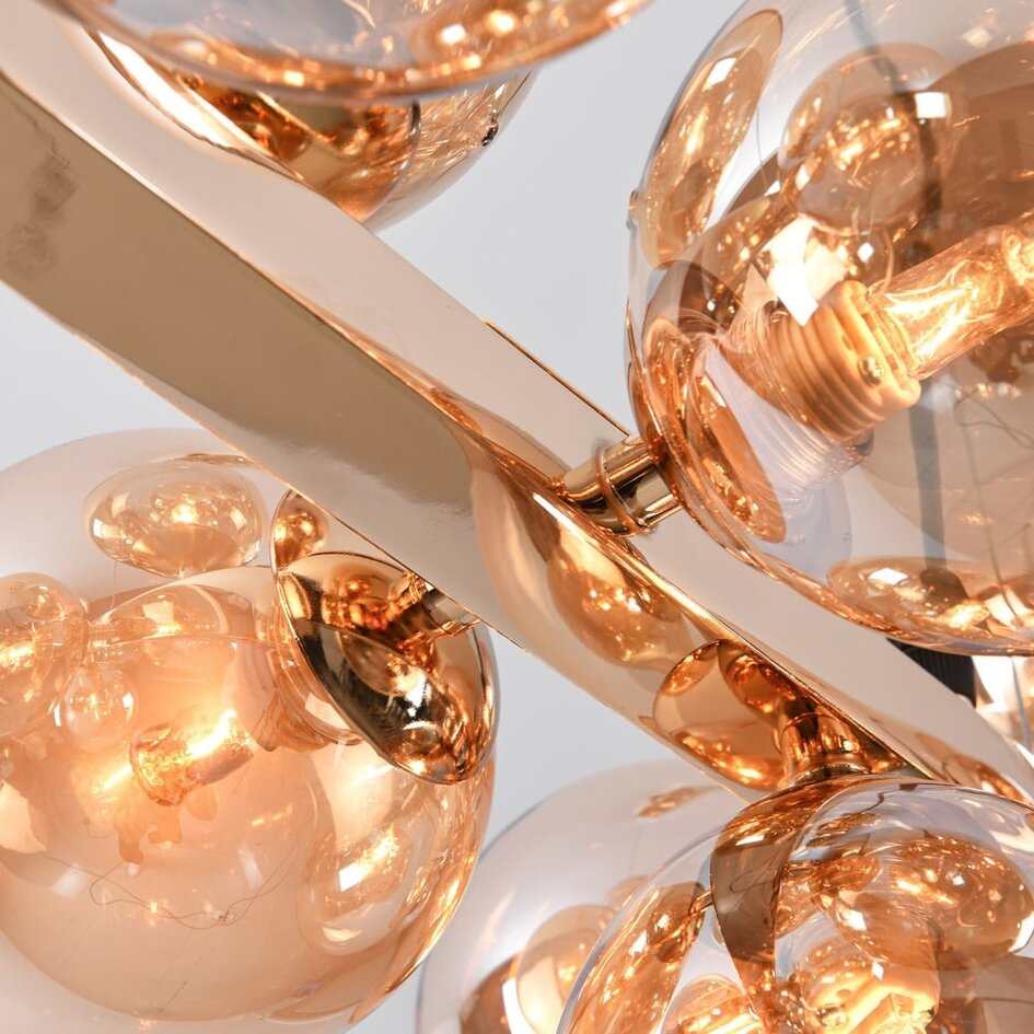 Lyxig pendellampa Sunita med sexton lampor - guld och amberfärgat glas