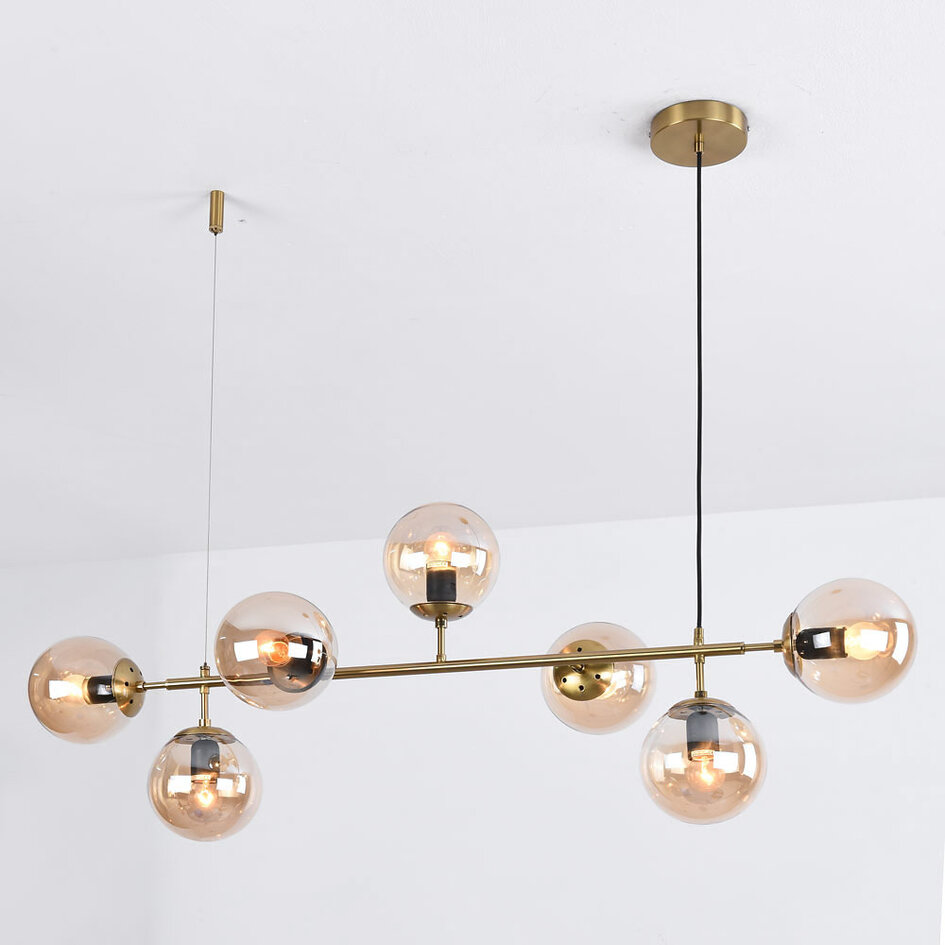 Designad pendellampa Hepta med 7 amberfärgade glaskulor