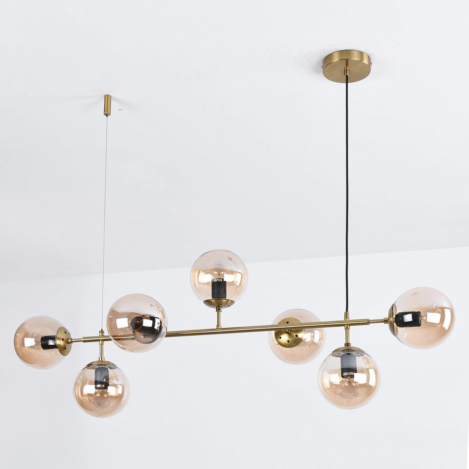 Designad pendellampa Hepta med 7 amberfärgade glaskulor