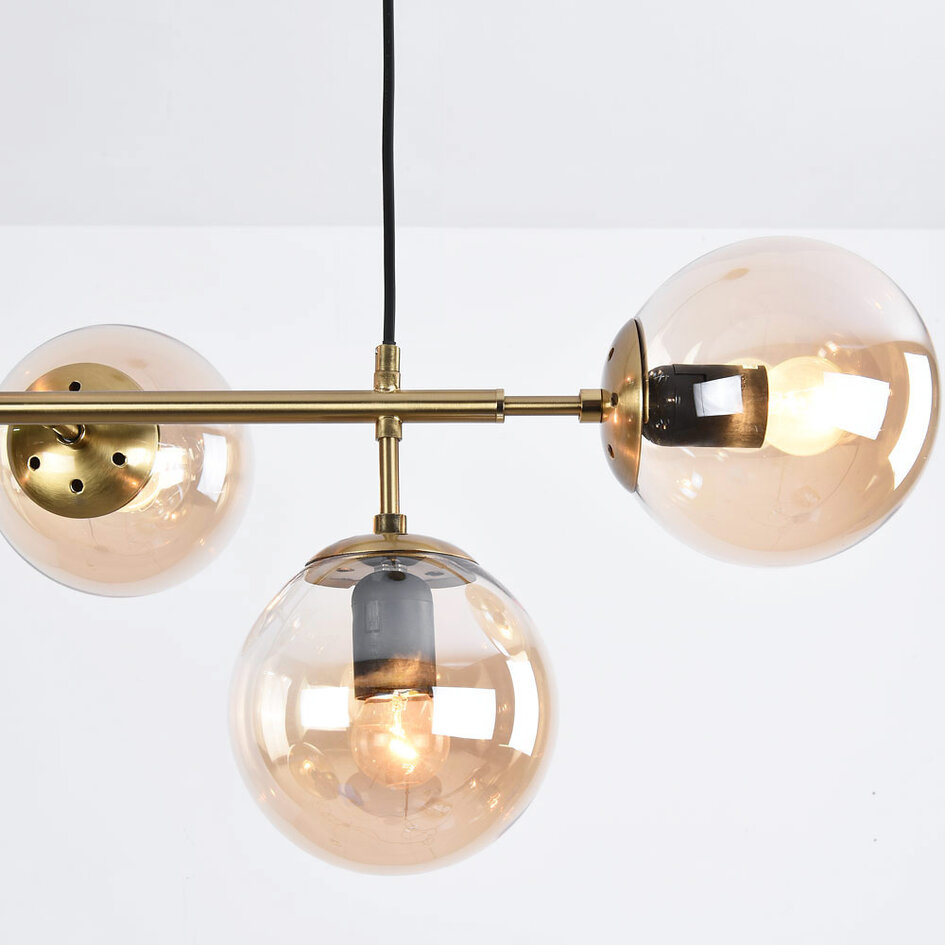 Designad pendellampa Hepta med 7 amberfärgade glaskulor