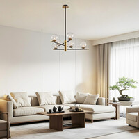 Pendellampa Nisha med sex lampor i transparent glas - svart och guld