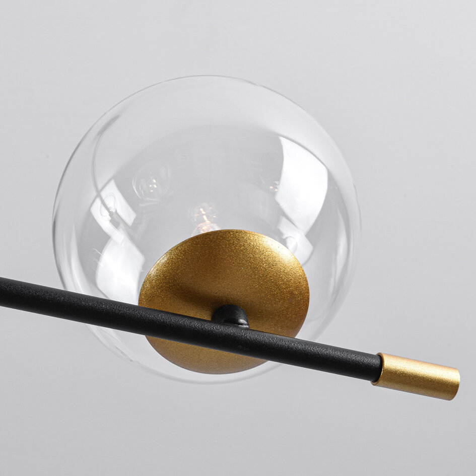 Pendellampa Nisha med sex lampor i transparent glas - svart och guld