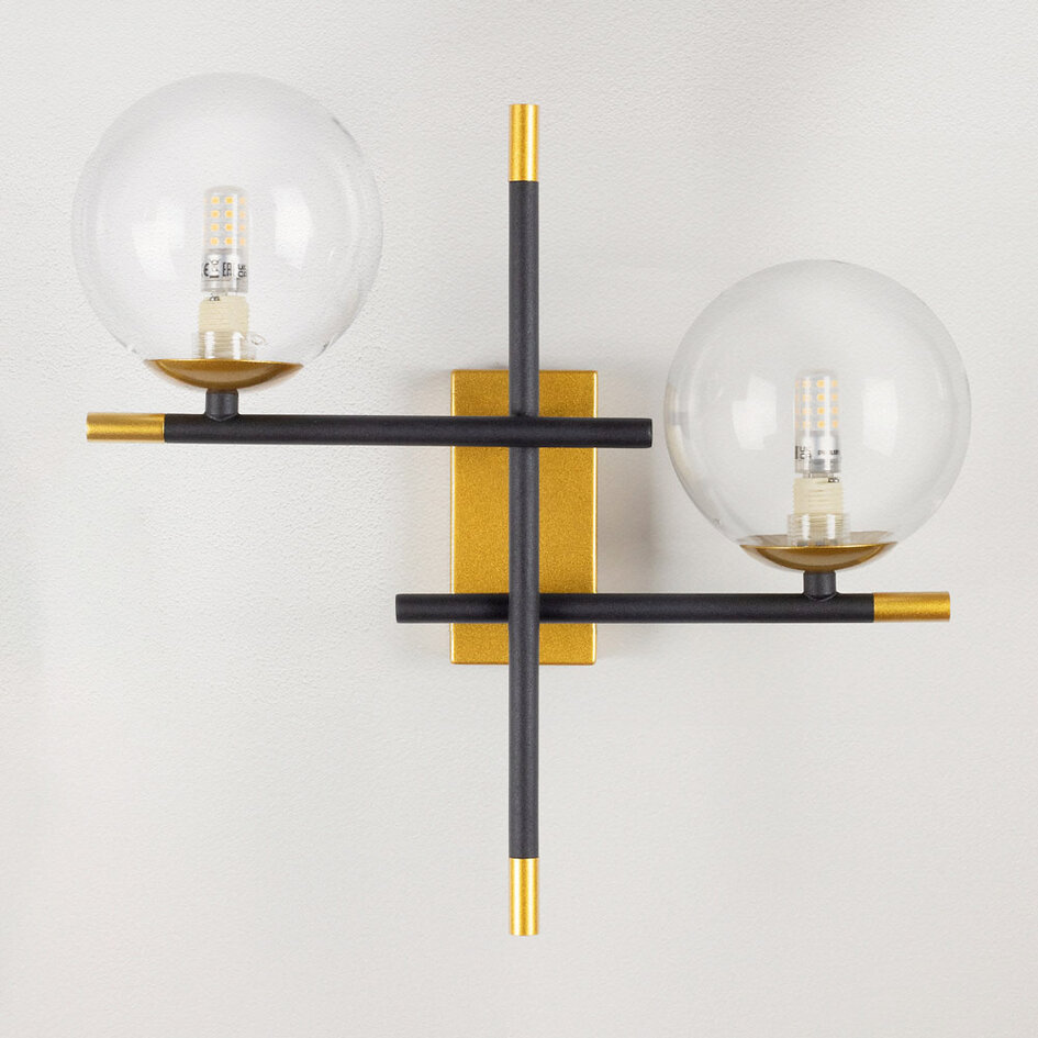 Vägglampa Niya med två lampor i transparent glas - svart och guld