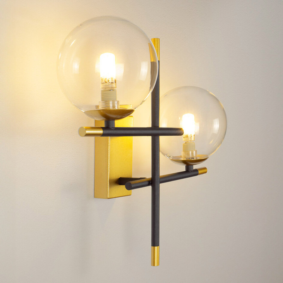 Vägglampa Niya med två lampor i transparent glas - svart och guld