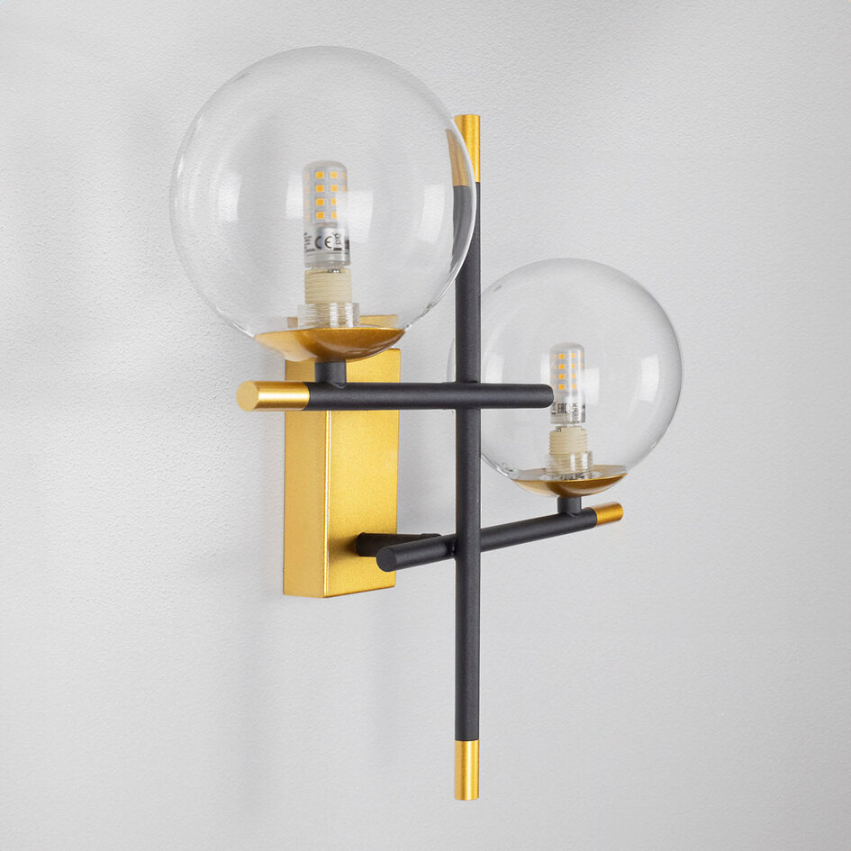 Vägglampa Niya med två lampor i transparent glas - svart och guld