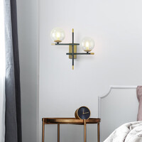 Vägglampa Niya med två lampor i transparent glas - svart och guld