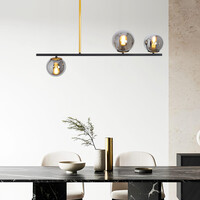 Designad pendellampa Danny med tre lampor och glaskulor