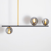 Designad pendellampa Danny med tre lampor och glaskulor