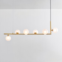Designad pendellampa Marcus med sex lampor i L-form och mjölkvitt glas