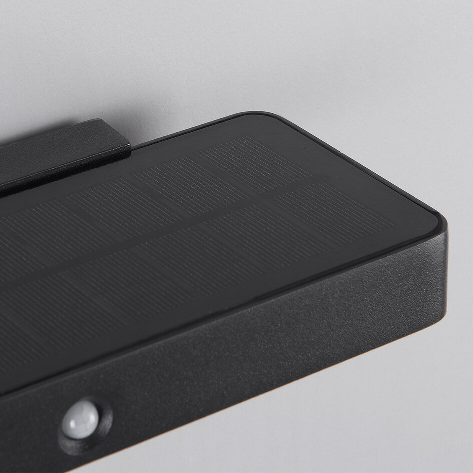 Kompakt solcellsdriven utomhusvägglampa med sensor Nero