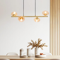 Pendellampa Soikea med fyra lampor - guld med amberfärgade glaskulor