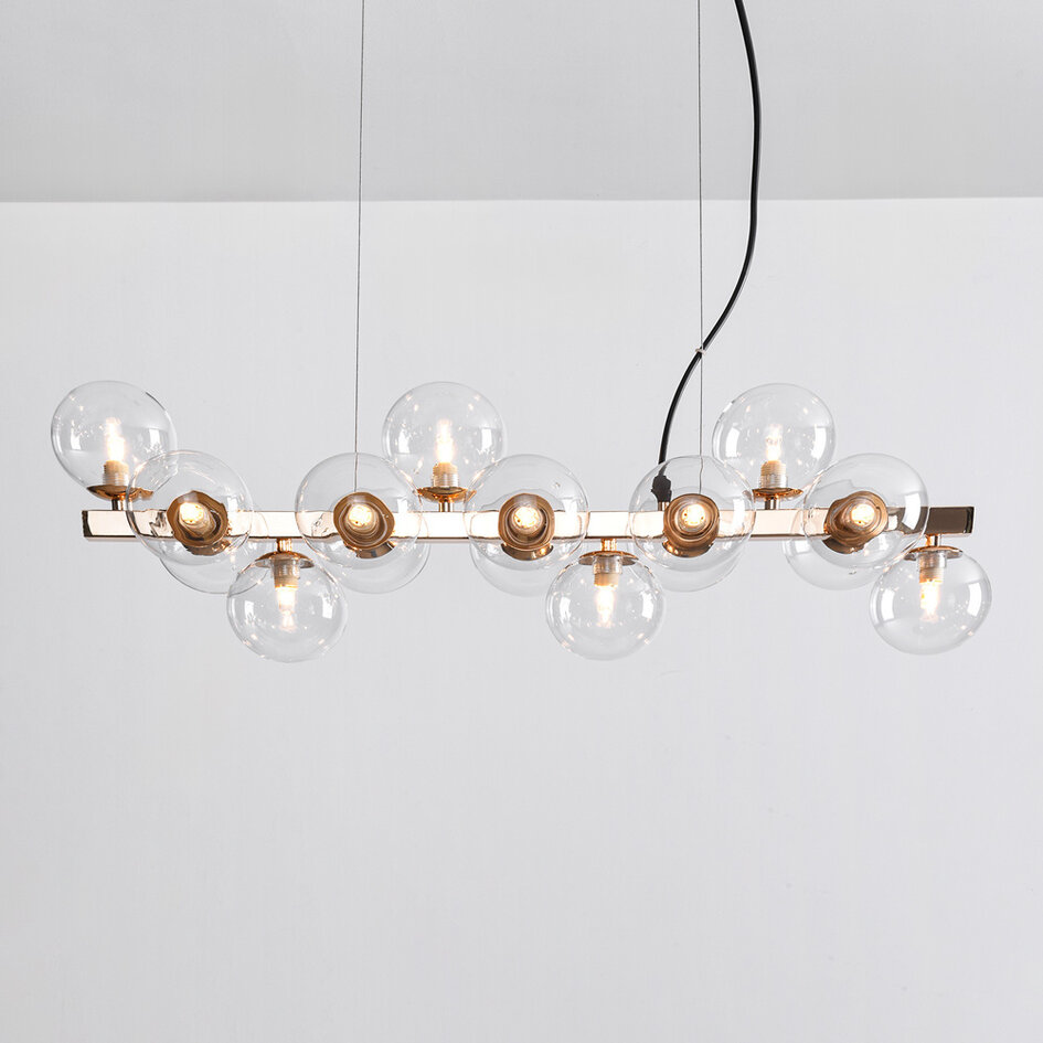 Pendellampa Sunita med sexton lampor - transparent glas med guld