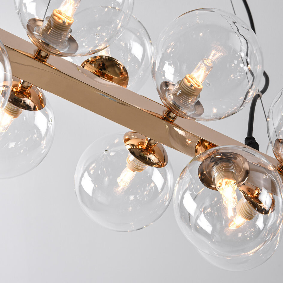 Pendellampa Sunita med sexton lampor - transparent glas med guld