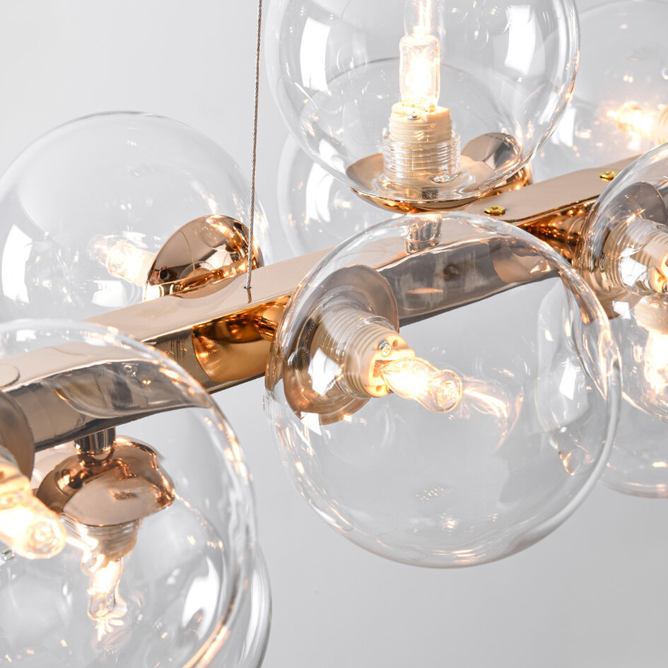 Pendellampa Sunita med sexton lampor - transparent glas med guld