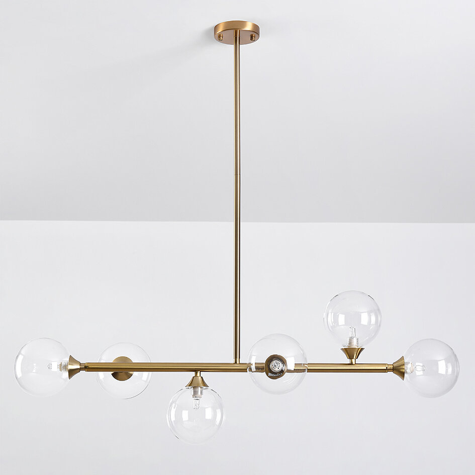 Pendellampa Aster med sex lampor - guld med transparenta glaskulor