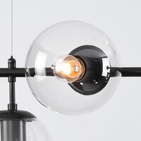 Pendellampa Hepta med sju lampor - transparent glas och svart